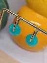 Créoles anneau ovale breloque ronde en résine bleu turquoise.webp